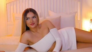 anais - Charming young Latina chats sweetly and poses on bed in clothes in front of camera