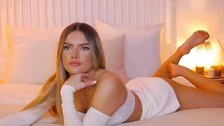 anais - Charming young Latina chats sweetly and poses on bed in clothes in front of camera