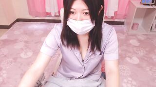 AYA285 -   Asian girl in pajamas is cute chatting and teasing in front of the camera