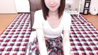 RIISAbbv  -  Skinny Asian girl sweetly chatting and teasing in her clothes in front of the camera