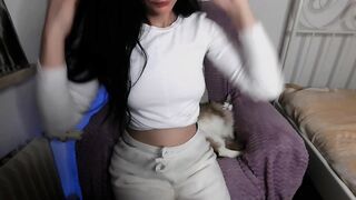 Emi21 - Brunette in clothes on a chair teasing in front of the camera and chatting sweetly with the chat room