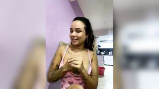 GoldenVeronica - young woman with tattoos chats sweetly and teases in front of the camera