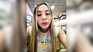 Alexa_fort - The young woman is having a nice conversation and filming herself on camera on the street