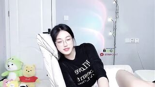 Caroline - Cute little Asian girl sweetly chatting and teasing in front of the camera