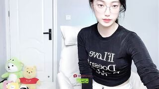 Caroline - Cute little Asian girl sweetly chatting and teasing in front of the camera