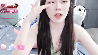 MinhHa - Slutty Asian girl sweetly chatting and teasing in front of the camera