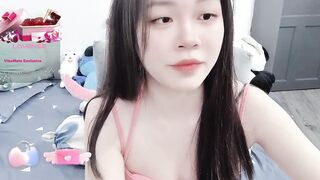 MinhHa - Asian girl sweetly chatting and teasing in front of the camera.