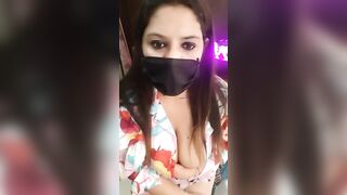 Reena_Darling - a latina in clothes sweetly chatting and teasing in front of the camera.